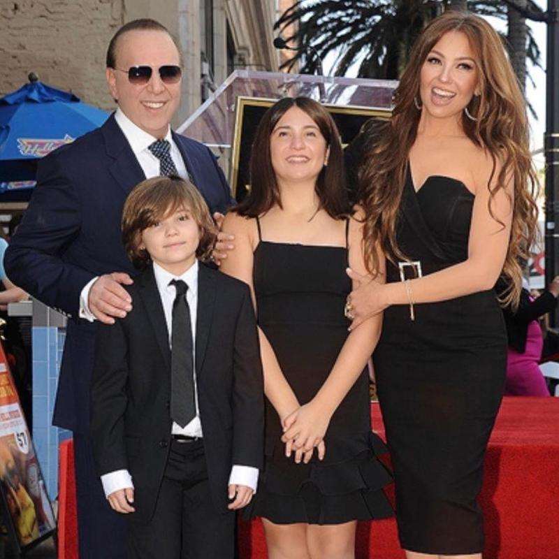 Image of fashion brand owner, Thalia with her family