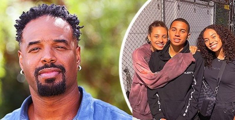 Image of an American multi-talented personality, Shawn Wayans and his kids