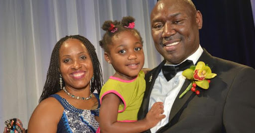 Image of an American-born graduate law degree holder, Dr. Genae Angelique Crump and husband and daughter