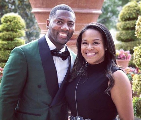 Image of an African American football player, Ryan Clark and wife