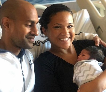 Image of a Chicago-based lawyer, Tony Balkissoon with wife and kid