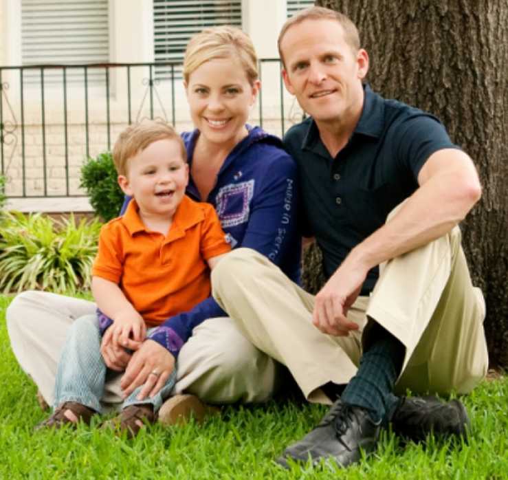 Grant Stinchfield with his son and girlfriend