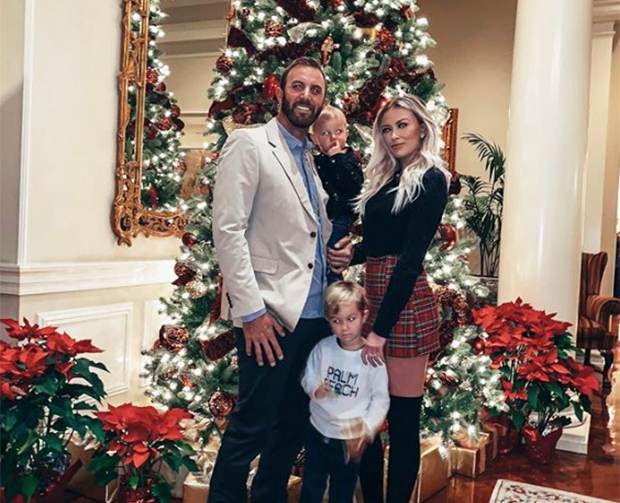 Paulina Gretzky in plade skirt with her husband and children