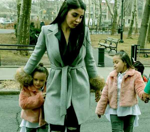 Emma Coronel with her twin daughters