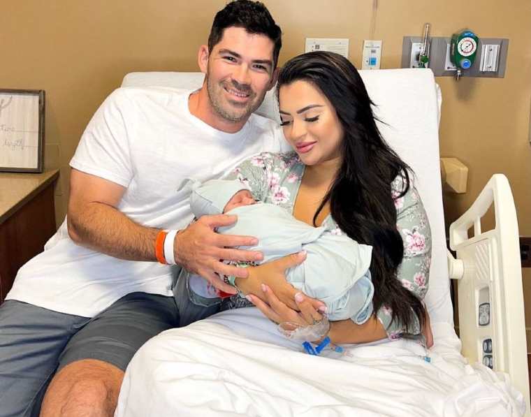 Nilsa Prowant looking happy with her husband, Gus and her baby
