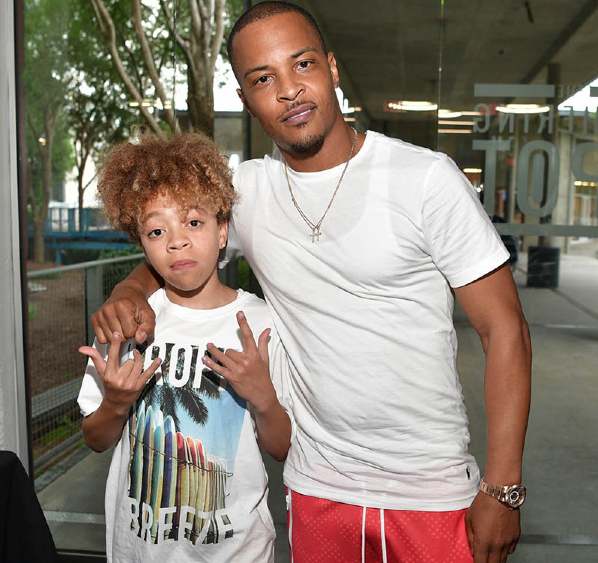King Harris giving poses with his father, T.I