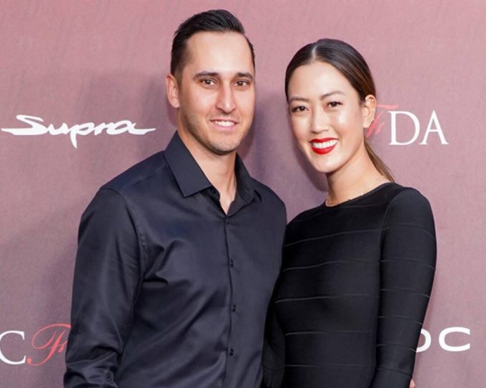 A good looking couple, Jonnie West and his wife, Michelle Wie