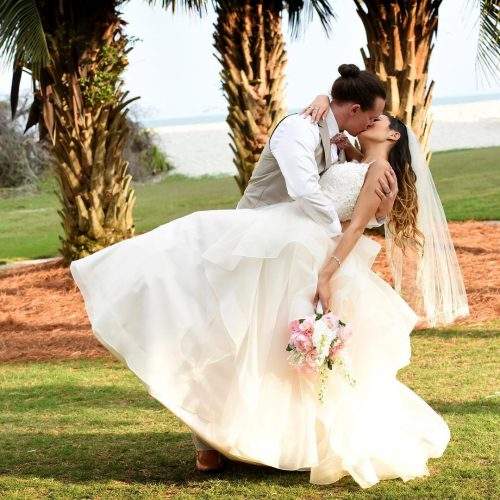 Keilah Kang kissing her husband, Ben in wedding dress