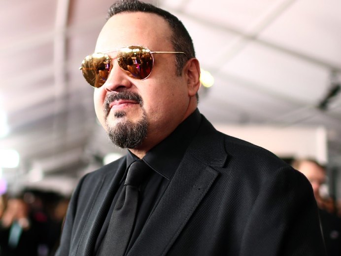 Pepe Aguilar, father of Aneliz Aguilar looking bold in balck coat