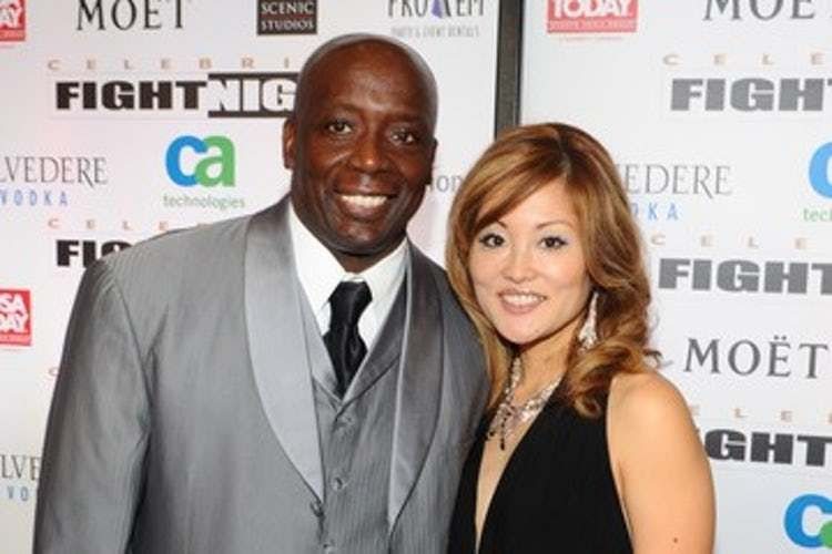 Tomoko Sato smiling with her husband, Billy Blanks