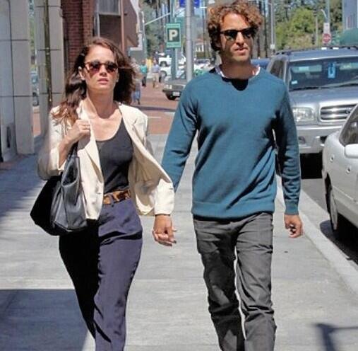 Nicky Marmet holding hand of his wife, Robin Tunney