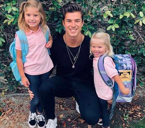 Chase Mattson looking happy with his daughters