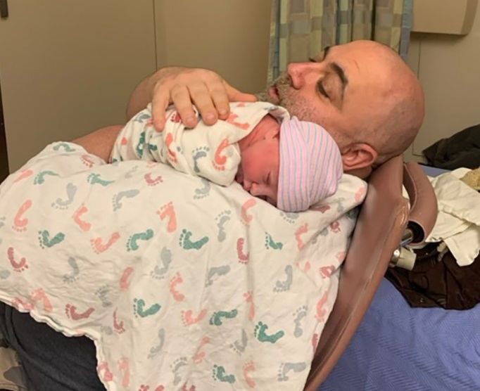 Johnna Colbry's husband with their baby daughter